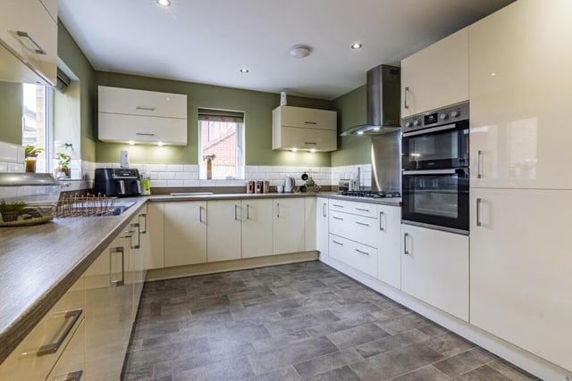 Let's begin our tour of the £575,000 Hucknall property in the state-of-the-art kitchen, which boasts sleek cabinets and integrated appliances.