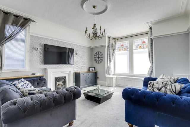 The living room encapsulates the charm on offer at the Station Road property. Facing the front, it boasts a stained glass, square bay window with fitted window seat, a feature fireplace with a decorative surround, a ceiling rose, a picture rail, a column radiator and coving to the ceiling.