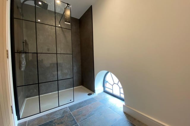 This superb en suite oozes modern style. The walk-in shower cubicle is complemented by a wash hand basin and low-level WC