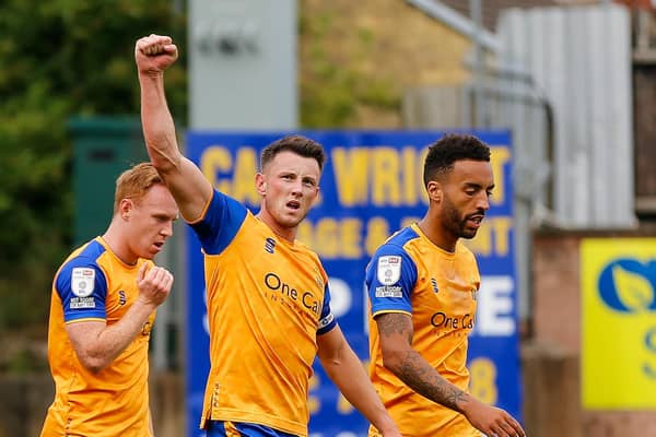 Ollie Clarke acknowledges the Mansfield fans after netting his winner.