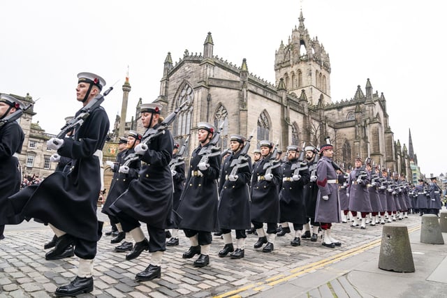 Members of the Royal Navy parade down the Royal Mile during the Remembrance Sunday service, past the Stone of Remembrance outside Edinburgh City Chambers in Edinburgh.