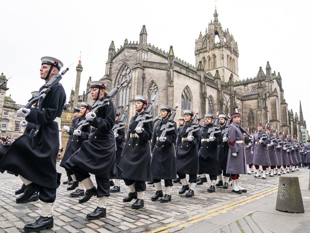 Members of the Royal Navy parade down the Royal Mile during the Remembrance Sunday service, past the Stone of Remembrance outside Edinburgh City Chambers in Edinburgh.