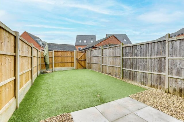 At the back of the house is this sizeable and private garden, enclosed by panelled fencing. It features a stone-paved patio area, a stone pebbled area, an artificial lawn and courtesy lighting.