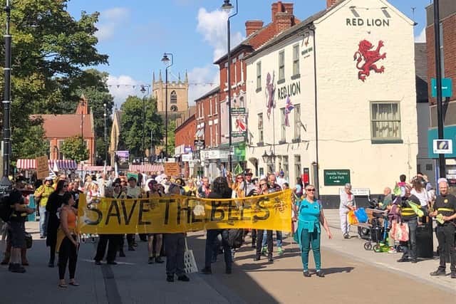 The campaigners marched down the High Street with banners and placards. Photo: Extinction Rebellion