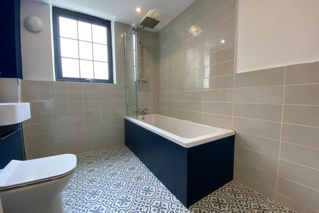 The family bathroom on the ground floor consists of a three-piece suite, with a double-glazed window to the side of the house.
