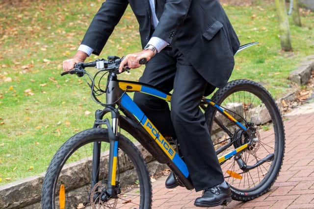Paddy Tipping tests out an electric bike.