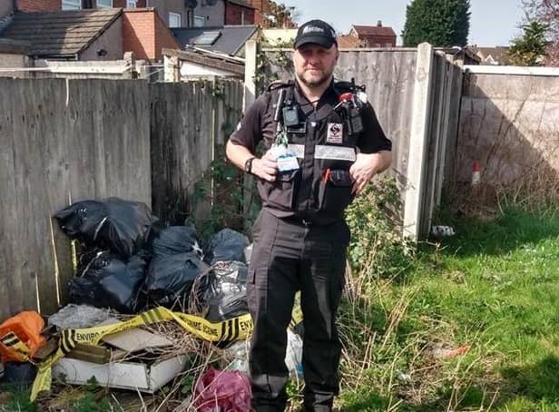 One of Ashfield District Council's community protection officers with fly-tipped waste on Beardall Street