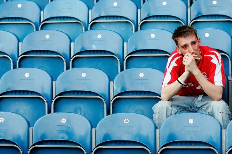 A Nottingham Forest fan looks dejected after his side lose during the Coca-Cola Championship match between Queens Park Rangers and Nottingham Forest at Loftus Road Stadium on April 30, 2005.
