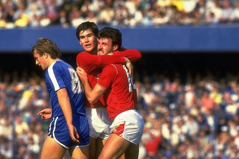 Nigel Clough hugs a team mate during a Barclays League Division One match against Chelsea at Stamford Bridge. Chelsea won the match 6-2.