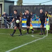 Players being led out for the last league game at Watnall Road on Saturday.