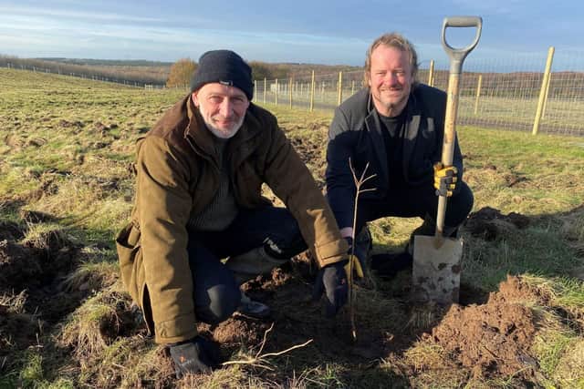 Nick Tucker (left), the council's Woodland Creation project manager and Coun Mike Adams at one of the tree-planting sessions