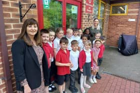 Butler's Hill head teacher Rachel Hallam (left) and deputy head Vicki Siddons celebrate the school's fine Ofsted report with members of the school council
