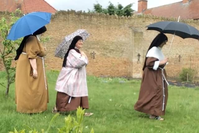 The sisters are walking 3.7 miles a day around their garden