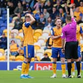 Referee Paul Howard issues Mansfield Town midfielder Stephen Quinn a red card - Pic Chris Holloway.