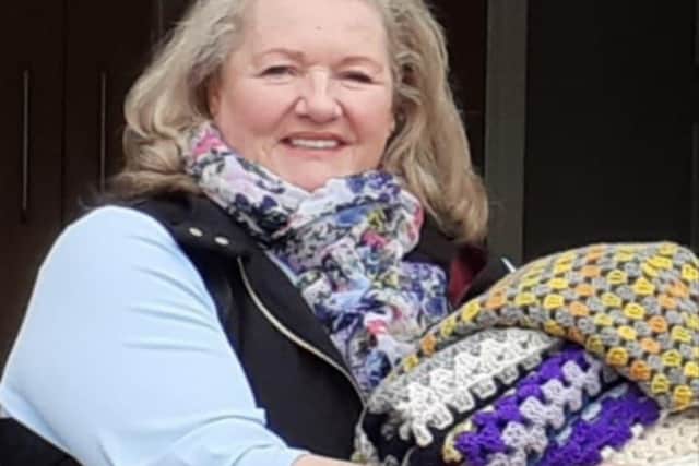 Jan Lees and her knitters and crocheters have made blankets for the brain injury unit