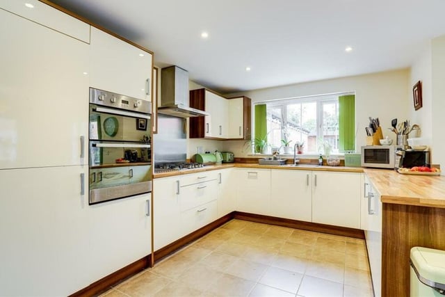 The kitchen/diner is full of high-quality, integrated appliances, including a double oven, gas hob, extractor hood, fridge/freezer and dishwasher. There is also a pantry, recessed spotlights and a tiled floor.