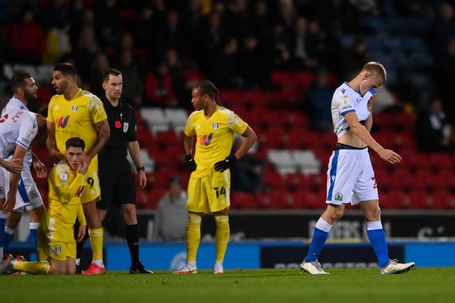 Jan Paul Van Hecke of Blackburn Rovers leaves the pitch following receiving a red card against Fulham.