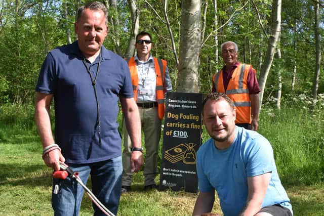 Coun David Martin, Coun Jason Zadrozny and council officers at the dog poo tree in Huthwaite's Brierley Forest Park.