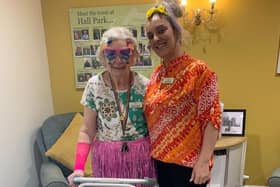 General manager Jodie Rakhra and a resident in their colours for pride