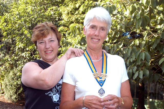 Anne Jackson, left, puts the chain of office around the neck of Glennis Butler President of the Inner Wheel Club of Kirkby (2007) at a ceremony held at the Eastwood Room at Portland College.