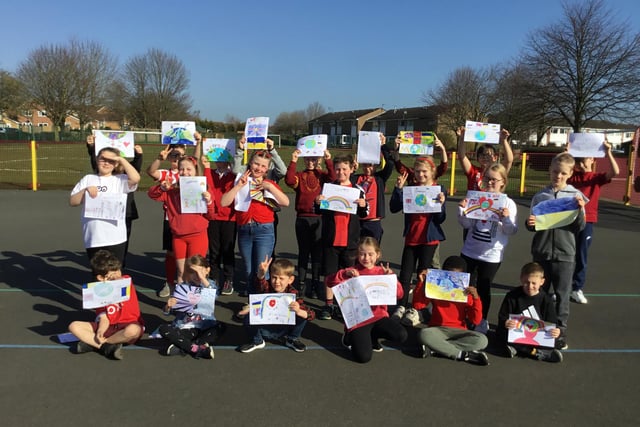 Pupils from Leen Mills School's Polar Bears class present their Letters of Hope
