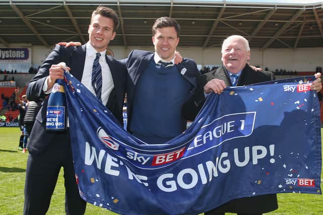 David Sharpe, when Wigan chairman, manager Gary Caldwell and owner Dave Whelan celebrate promotion to the Championship in 2016