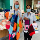 Nottingham City Hospital staff with blankets knitted by the Fairway View residents