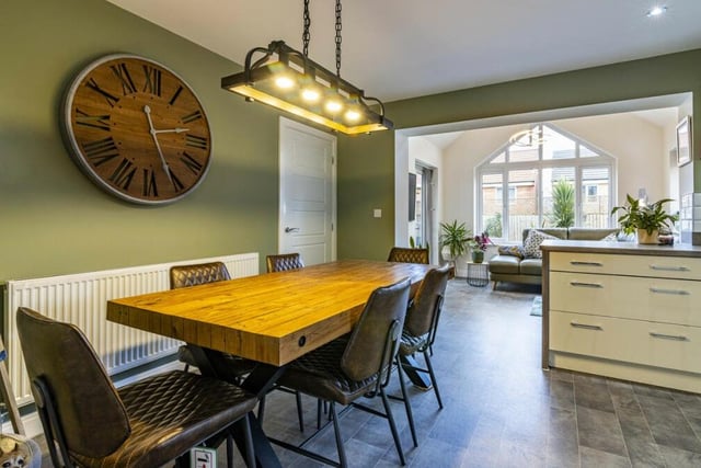 The kitchen has plenty of space for a stylish dining area, ideal for family meals or for entertaining guests at dinner parties.