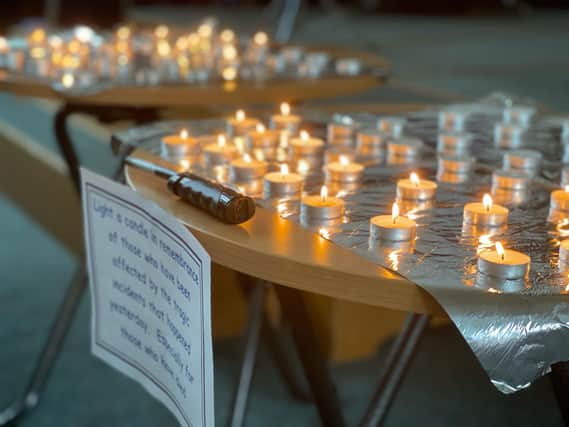 People lit candles to remember the victims at the Hucknall vigil