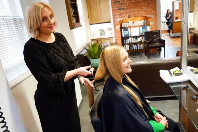 Kayte Baxter having her hair cut for Little Princess Trust at Arena Hair in Hucknall by senior stylist Kerry-Anne Furness.