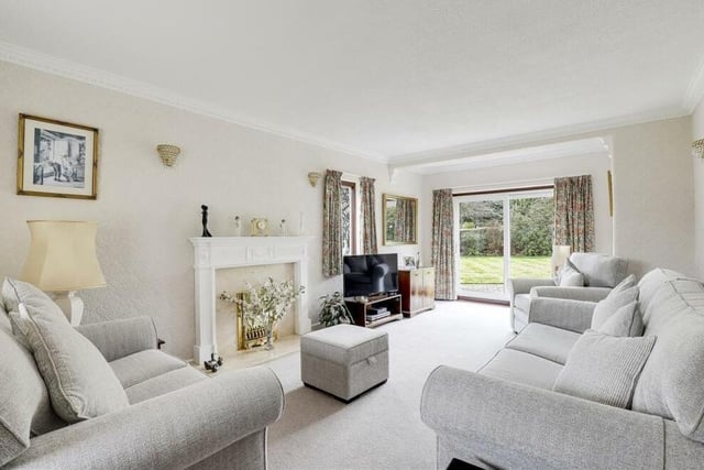 The best place to start our tour of the Wood Lane property is the lovely living room. Attractive features include a feature fireplace with decorative surround, and uPVC sliding patio doors giving access to the back garden.