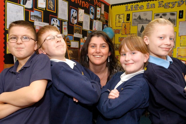 Deputy head Katie Pritchard, from Bonnington Junior School in Bulwell, is shown with some of her proud pupils after they heard their good Ofsted result.