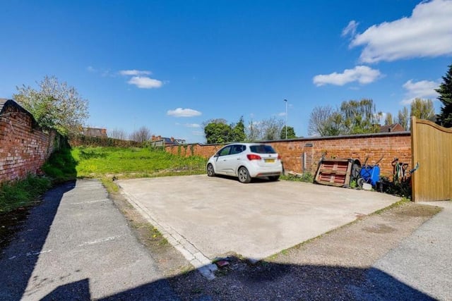At the back of the property is an enclosed garden with double-gated access to off-street parking space for many vehicles. There is also a lawn and brick-built boundaries.
