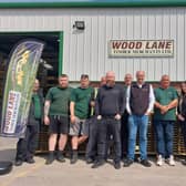 Pat Kelly (centre) and the Wood Lane Timber team are celebrating 20 years in business