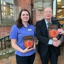 Michael Heath (right) has presented a copy of his debut novel to Hucknall Library. Receiving the book are Coun John Wilmott and Jo Cannon, library customer services advisor