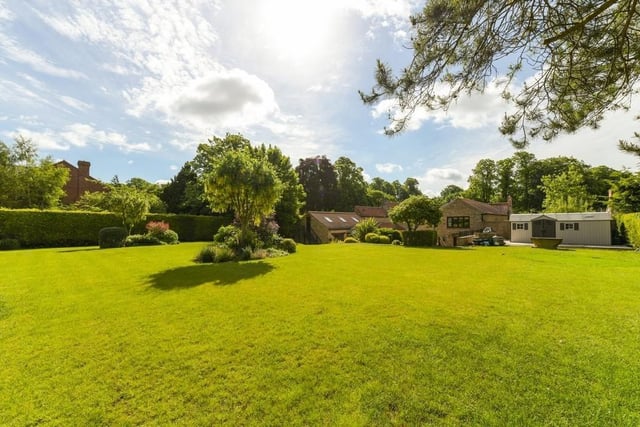 Greenery abounds at the back of the £1.25 million house, with far-reaching views of the countryside.