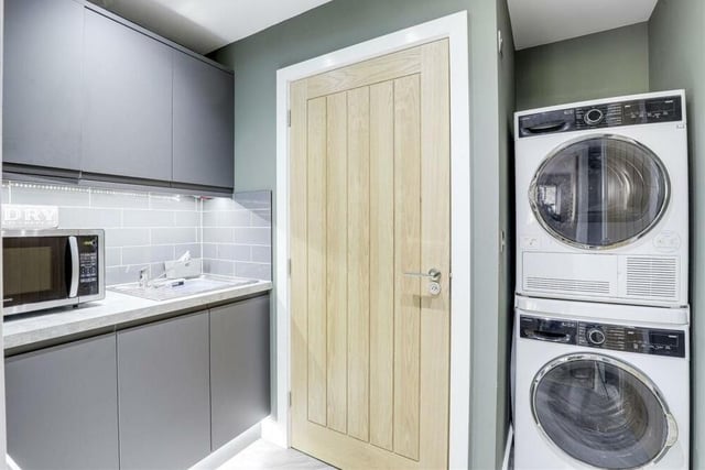 Close to the kitchen/diner at the £500,000 bungalow is this practical utility room, which makes daily chores a breeze. There is plumbing and space for a washing machine and tumble dryer, while the room is equipped with a stainless steel sink, wall and base units, worktops and a storage cupboard.