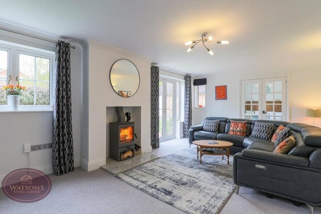 Let's begin our tour of Amelia Cottage in the pleasant lounge, which comes with an inset log-burner and also two sets of French doors. One leads to the rear garden, while the other gives access to the dining kitchen.