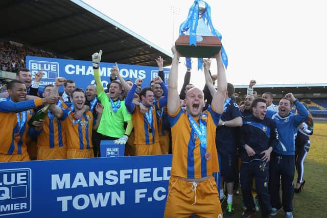 Skipper Adam Murray of Mansfield lifts the Blue Square Bet Premier League trophy.