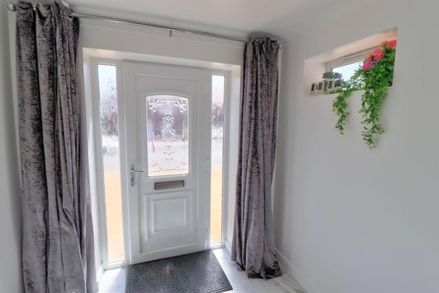 The uPVC double-glazed front door welcomes you into the house, via a light and airy entrance hallway that has a tiled, marble-effect floor with underfloor heating.
