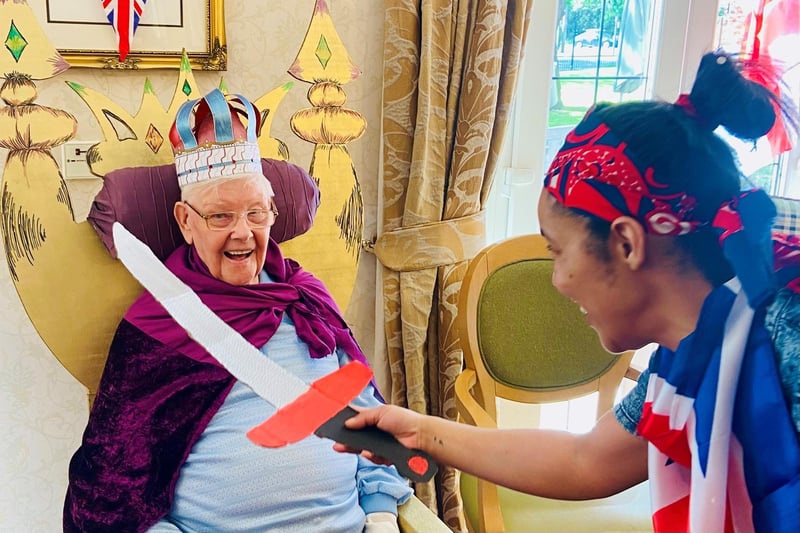 Staff and residents held a celebration party with food, music and a special 'knighthood' for resident Danny