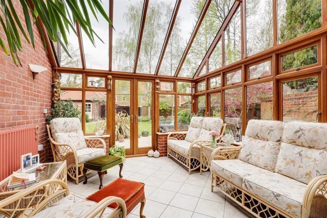 The appearance of the superb conservatory is in keeping with the rest of the property. It features tiled flooring, exposed-brick walls, a half-vaulted glass roof and double doors that open out on to the back garden.