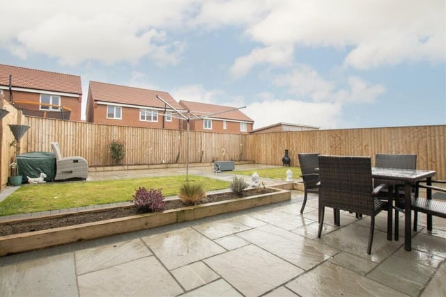 A closer look at the patio seating area in the back garden, which is a fantastic space for entertaining family and friends.