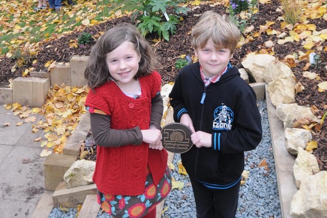 2010: Isa Ackroyd and George Allcock hold the plaque to mark the opening of the new sensory garden at Hucknall National Primary School.