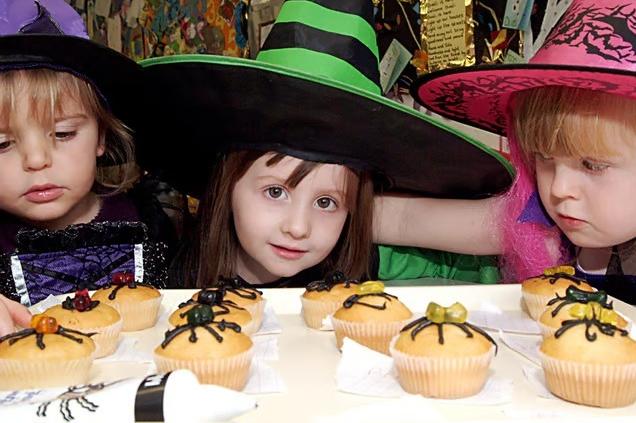 Showing off their spooky baking skills back in 2006, this young trio presents their freshly made spider cakes during the Halloween festivities at Hucknall Day Nursery