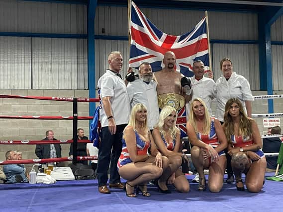 Steve Ward is pictured with his wife, daughters and coaches after his world title win.
