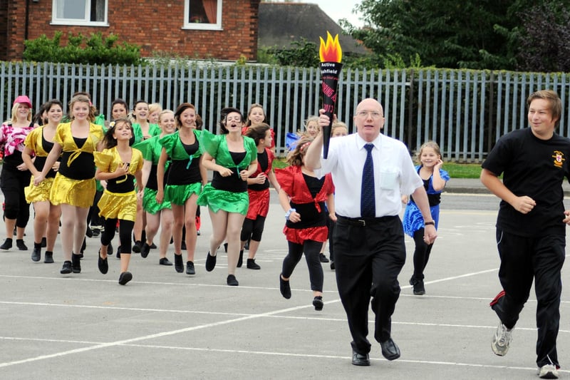 2010: Councillor John Wilmott runs with the official torch at an event to open the new AdiZone Centre in Hucknall.