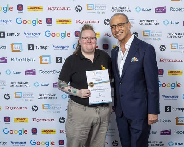 Jo O'Neil being presented with the Small Business Sunday Award by Theo Paphitis