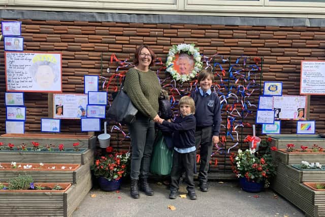 Pupils Samuel and Henry visited the mural with their mum Rachel after school. Photo: Lou Brimble