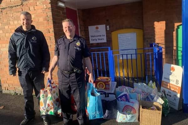 Hucknall firefighters at one of last year's pick-up points with several bags of donations. Photo: Submitted
